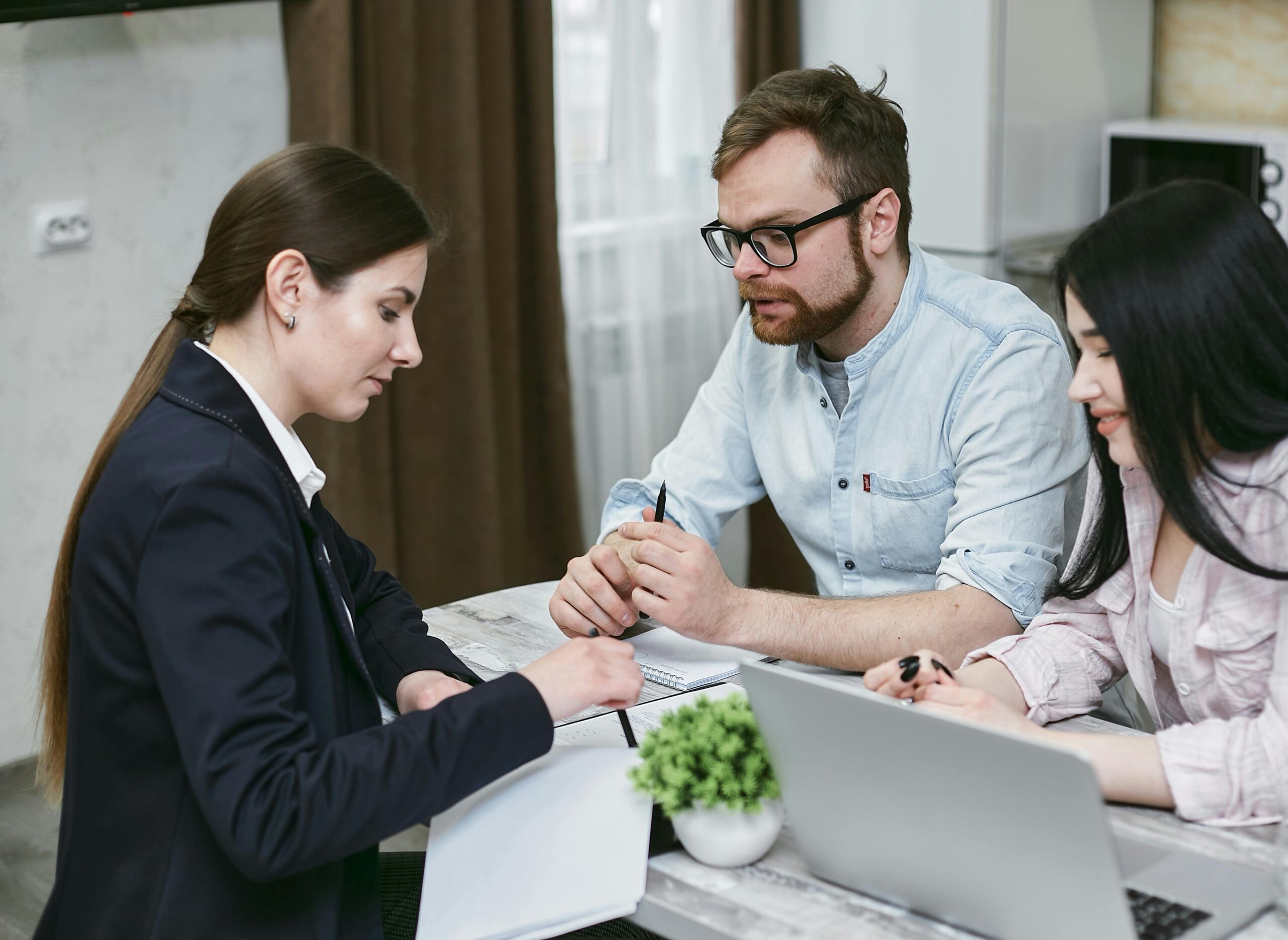 Three people having a conversation.