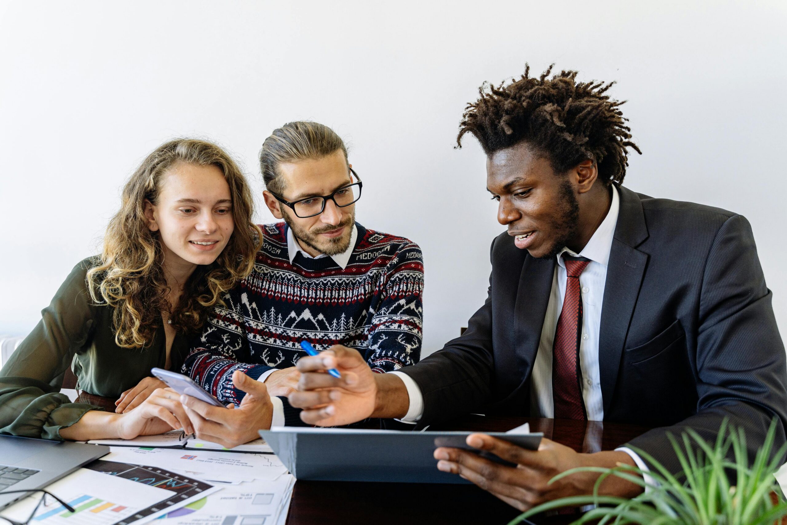 Three people in the middle of a meeting.